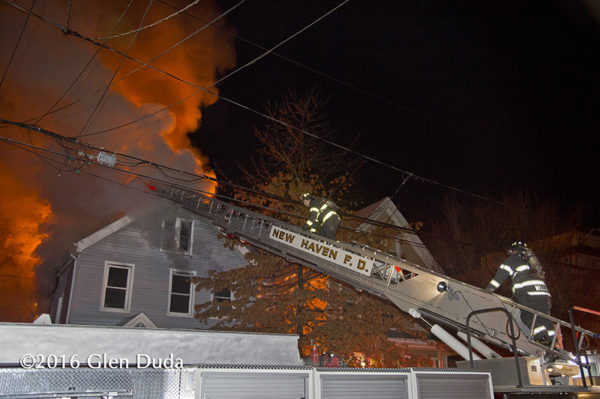 New Haven firefighters battle a house fire