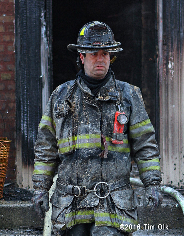firefighter after battling a house fire