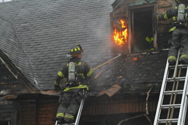 firefighters battle house fire