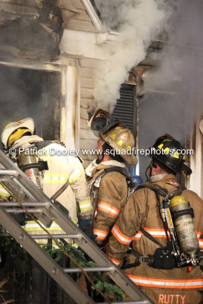 firefighters working at a house fire