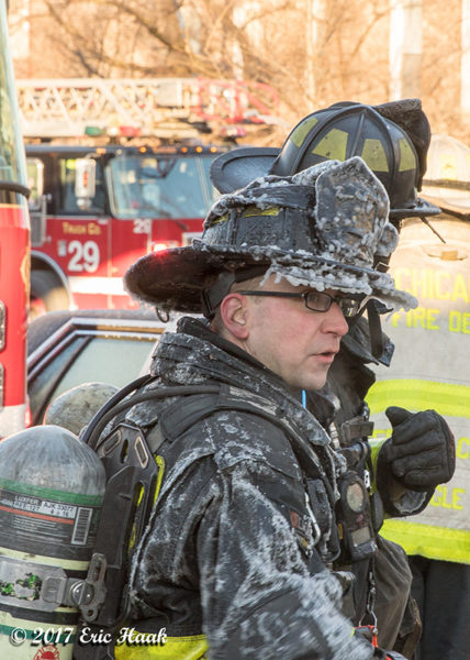 firefighter covered with ice after fire