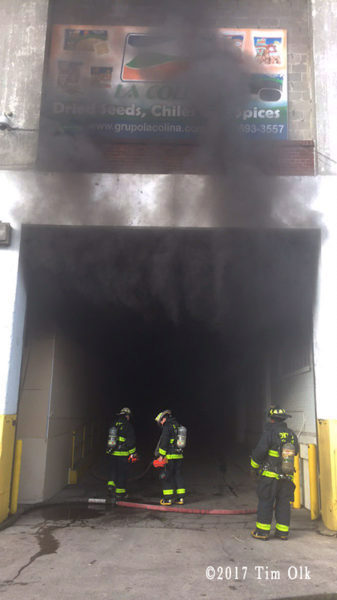 heavy smoke from warehouse building