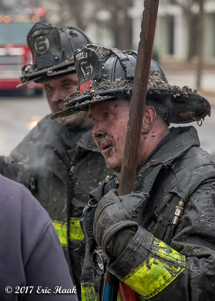 Chicago Firefighters with dirty faces after battling a fire