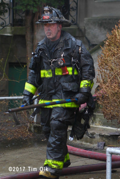 firefighter with dirty face after battling a fire