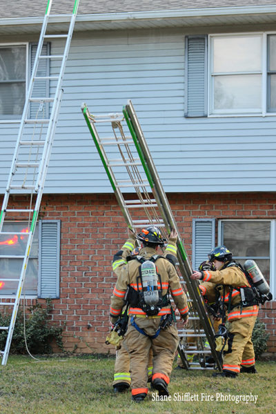 firefighters lower ground ladder