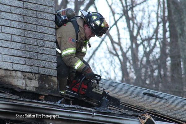 firefighter vents house roof