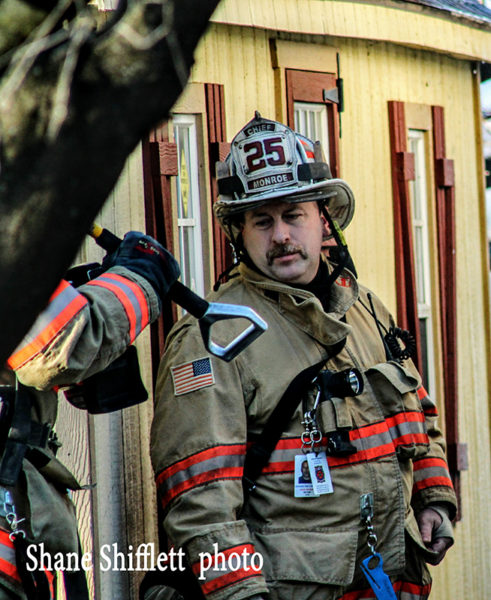 volunteer fire chief at fire scene