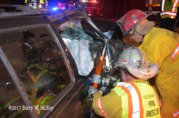 firefighters use Holmatro rams during crash extrication
