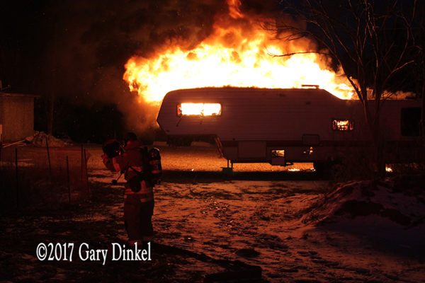 recreational trailer engulfed in fire