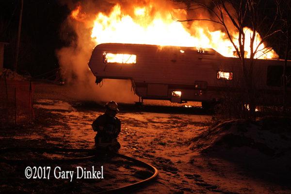 recreational trailer engulfed in fire