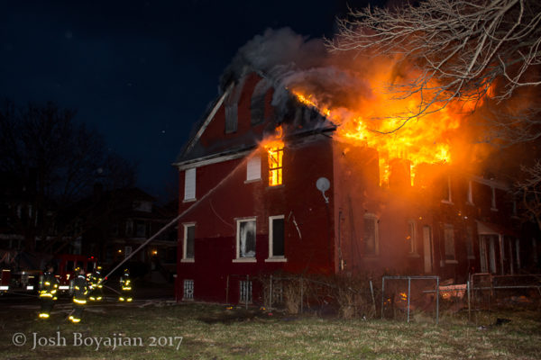 heavy flames engulf house at night