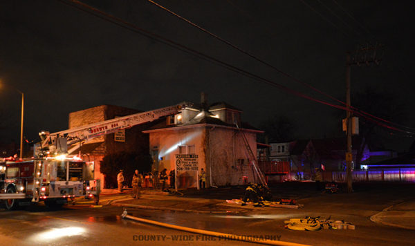 fire scene with Seagrave ladder truck