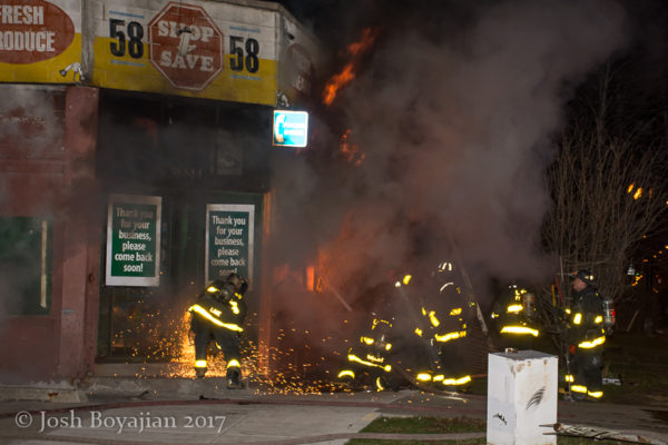 Chicago firefighters battle storefront fire