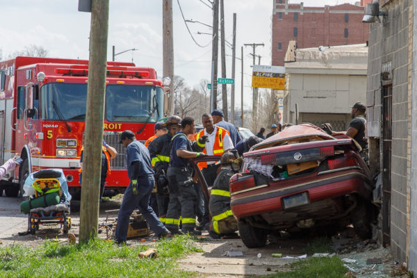 firefighters free crash victim from car