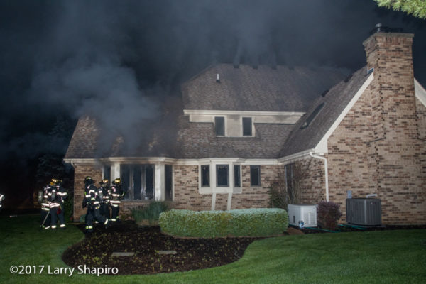 smoke pushes from house on fire