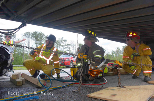 firefighters use Holmatro rescue tools at crash site