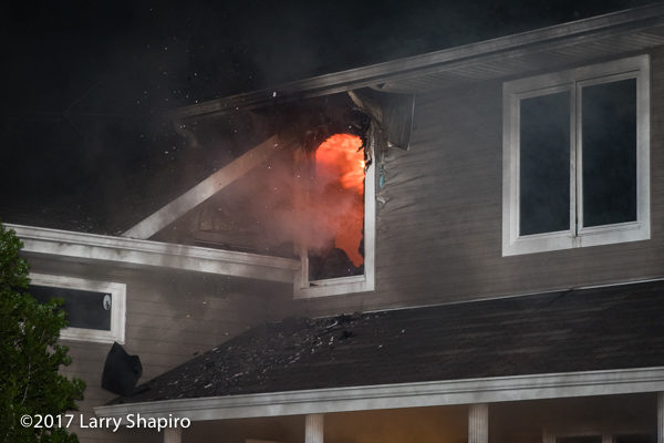 flames from window of house on fire