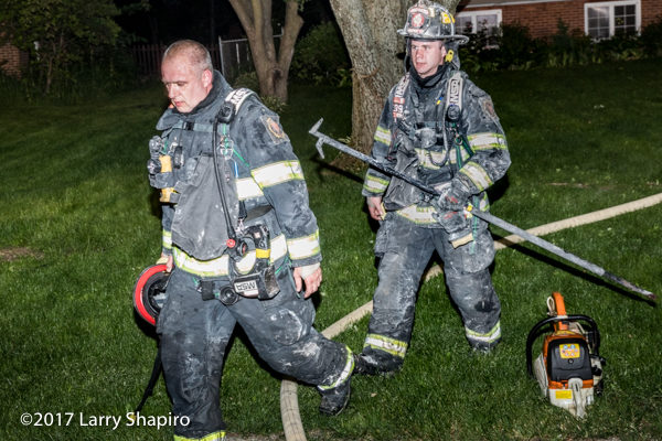 Firefighters after battling a house fire