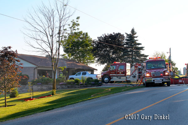 fire trucks at house fire in Wellesley Township ON