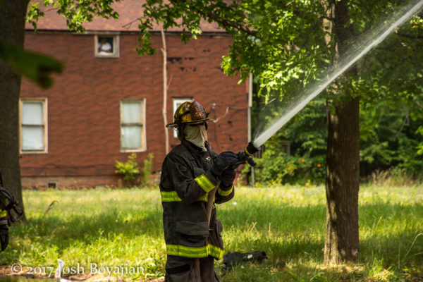 Detroit firefighter with hose line