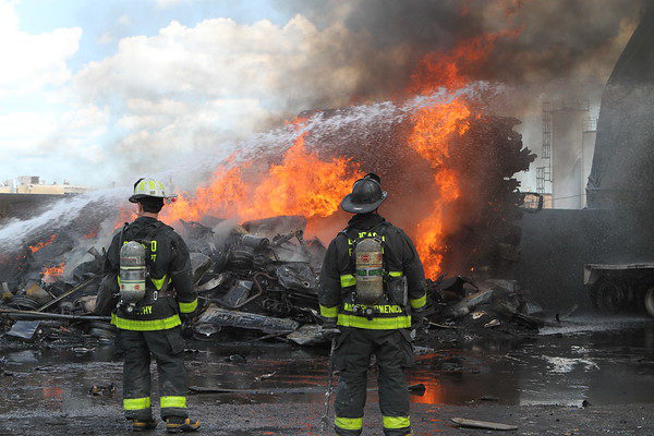 Chicago firefighters battle fire in a junkyard