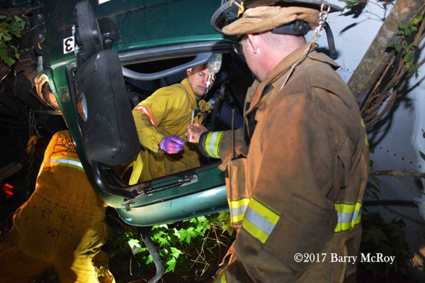 Firefighter-Paramedics treat victim trapped in a truck