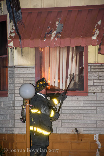 firefighter vents a window
