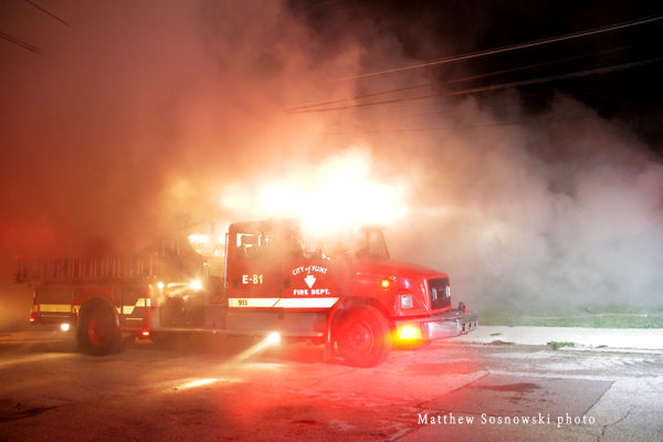 Flint fire engine at night engulfed in smoke