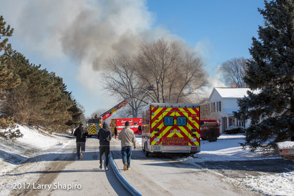 fire apparatus in street during house fire