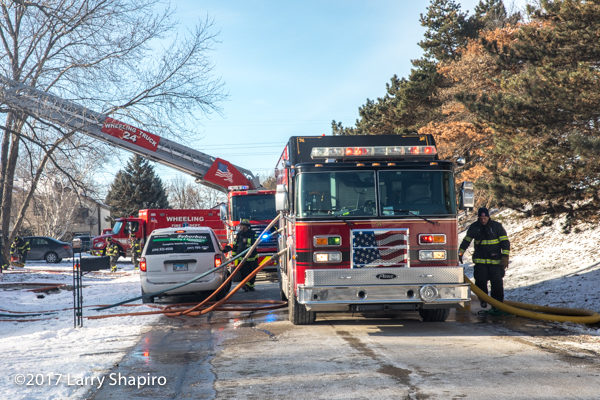 fire apparatus in street during house fire