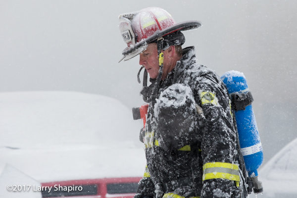 firefighter coated with ice