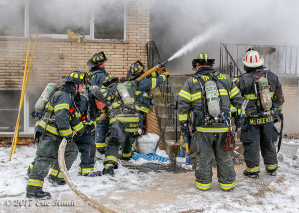 firefighters battle winter house fire