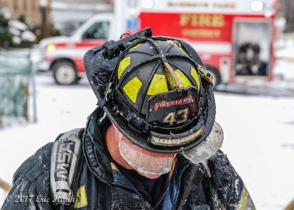 firefighter with ice on helmet