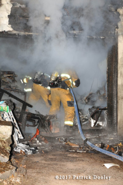 firefighters battle a basement fire