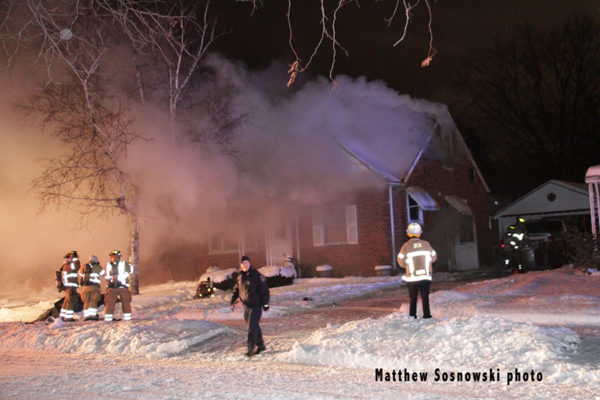 winter house fire at night