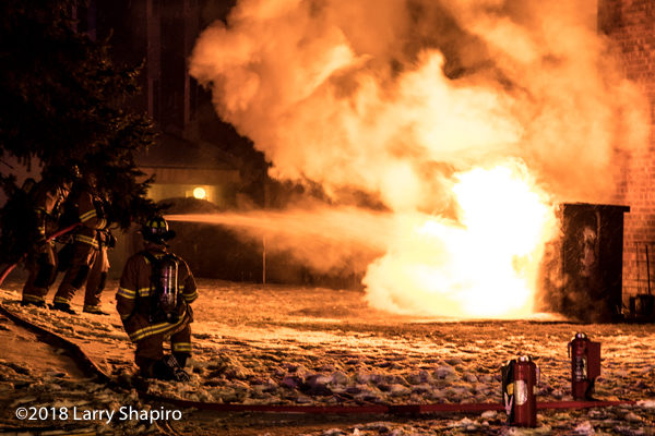firefighters attempt to extinguish huge flames that engulf electric control box