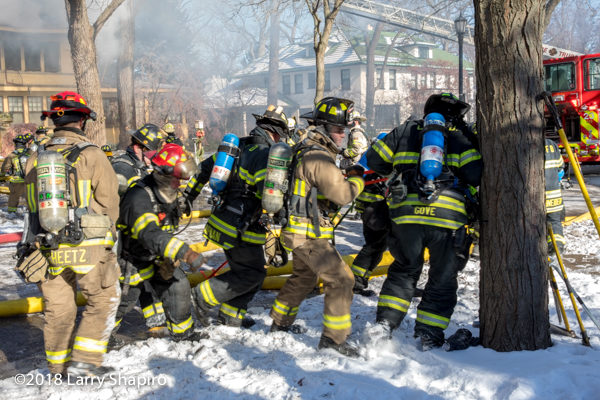 firefighters work together to move LDH