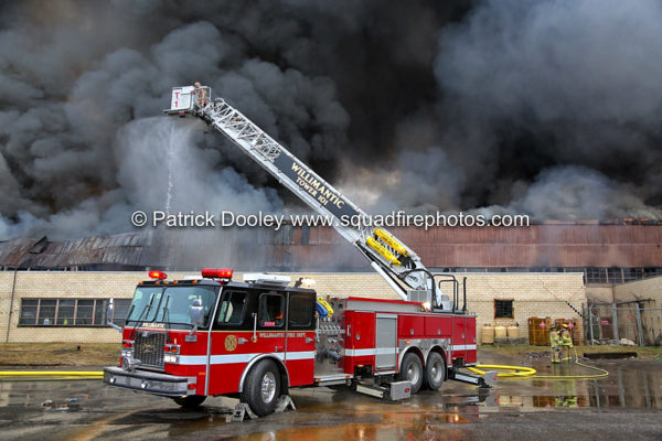 E-ONE tower ladder working at a 4-Alarm fire at a recycling plant in Willimantic CT