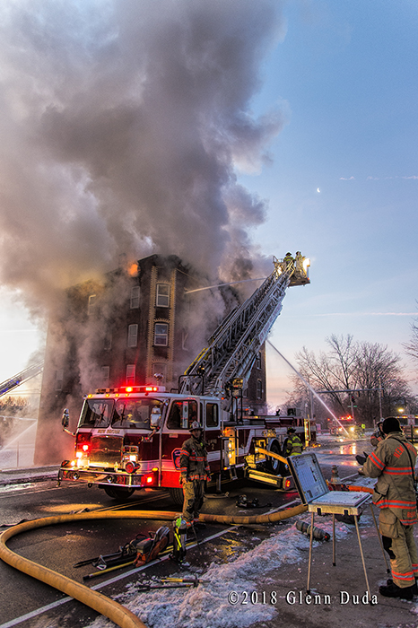 E-ONE mid-mount tower ladder at fire scene | FireScenes.Net