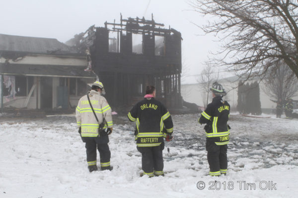 Firefighters at winter fire scene