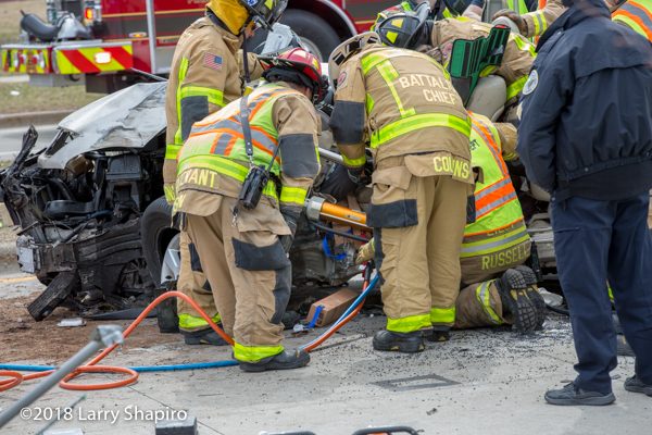 Firefighters use Holmatro rescue spreaders at crash