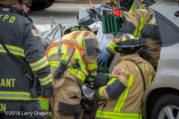 Firefighters use Holmatro battery spreader at crash
