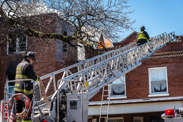 aerial ladder to the roof of fire building