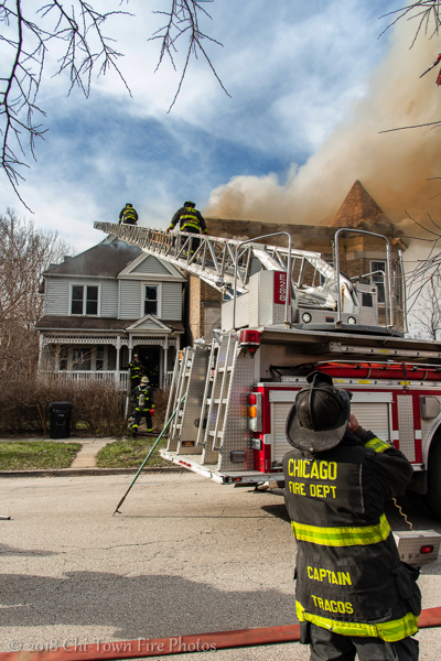 Chicago Firefighters at house fire with ladder truck