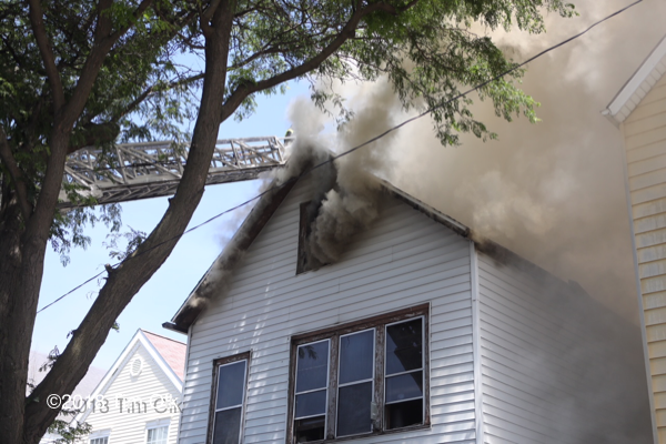 smoke from attic of house on fire