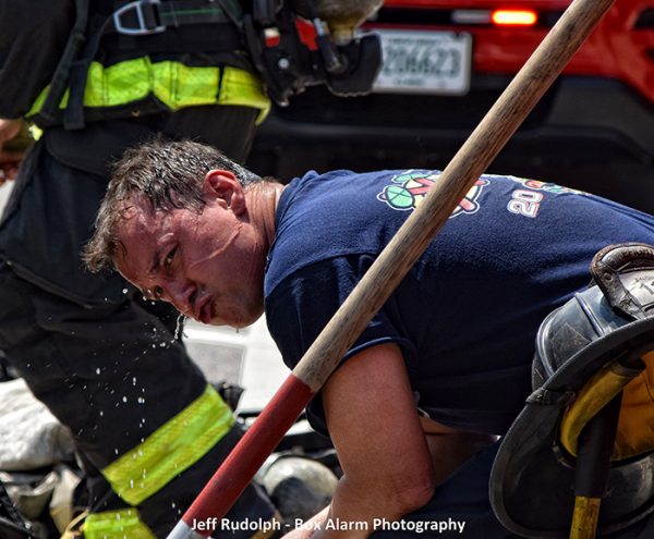 Firefighter cooling off on a hot day after a fire