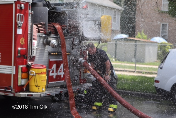 Firefighter cools down on hot day