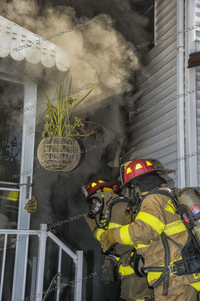 Firefighters enter house filled with smoke
