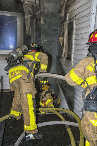 Firefighters enter house filled with smoke