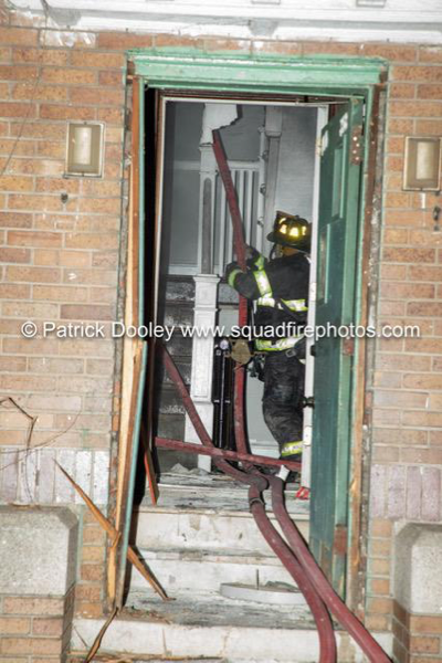 Firefighter in stairwell with hose